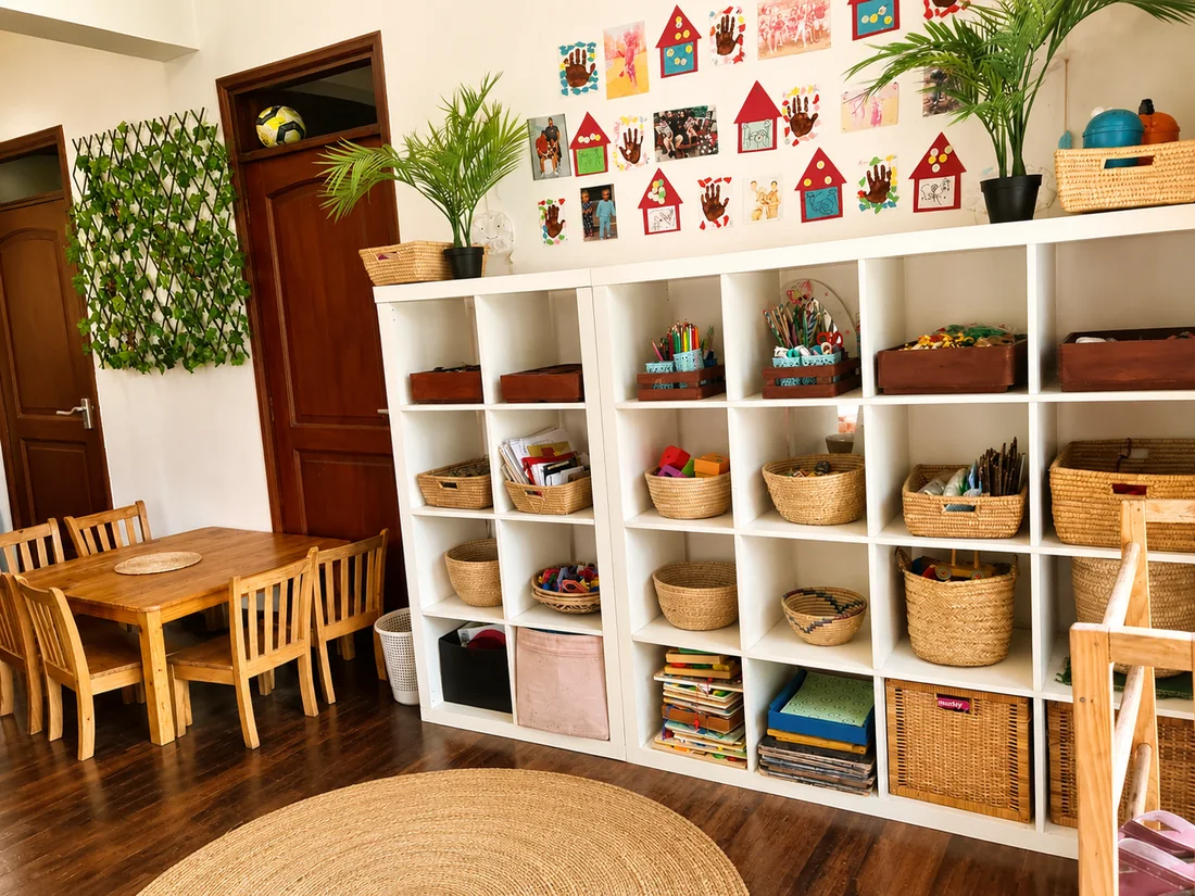The Toddler Room at The Little Nest — open shelving, natural materials and children's artwork